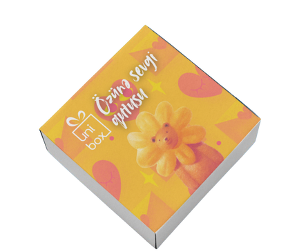 Small box with a floral design and text on a white background