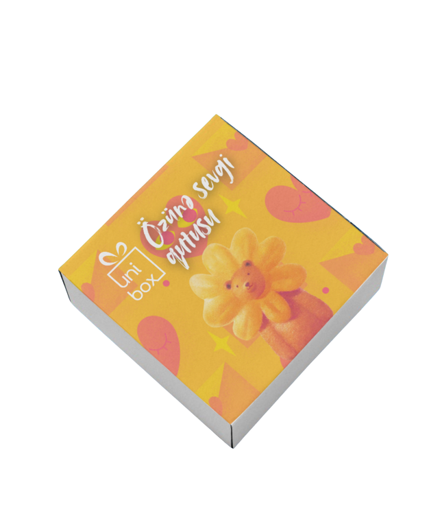 Small box with a floral design and text on a white background